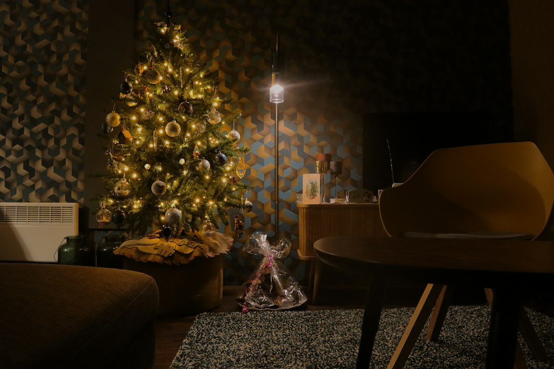 Festive Christmas living room with decorated tree and warm holiday lights