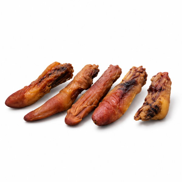Five dehydrated pork tails dog chews on white